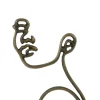 Light en Living Wandornament FACE antiek brons - 2 afmetingen