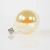 WoonStijl Lichtbron LED filament bol Ø12 5 - E27 6W 2100K 450lm dimbaar / Amberkleurig glas