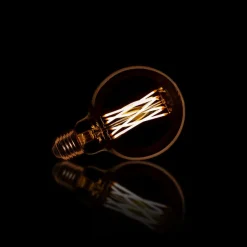 WoonStijl Lichtbron LED filament bol Ø9 5 - E27 6W dimbaar / Amberkleurig glas